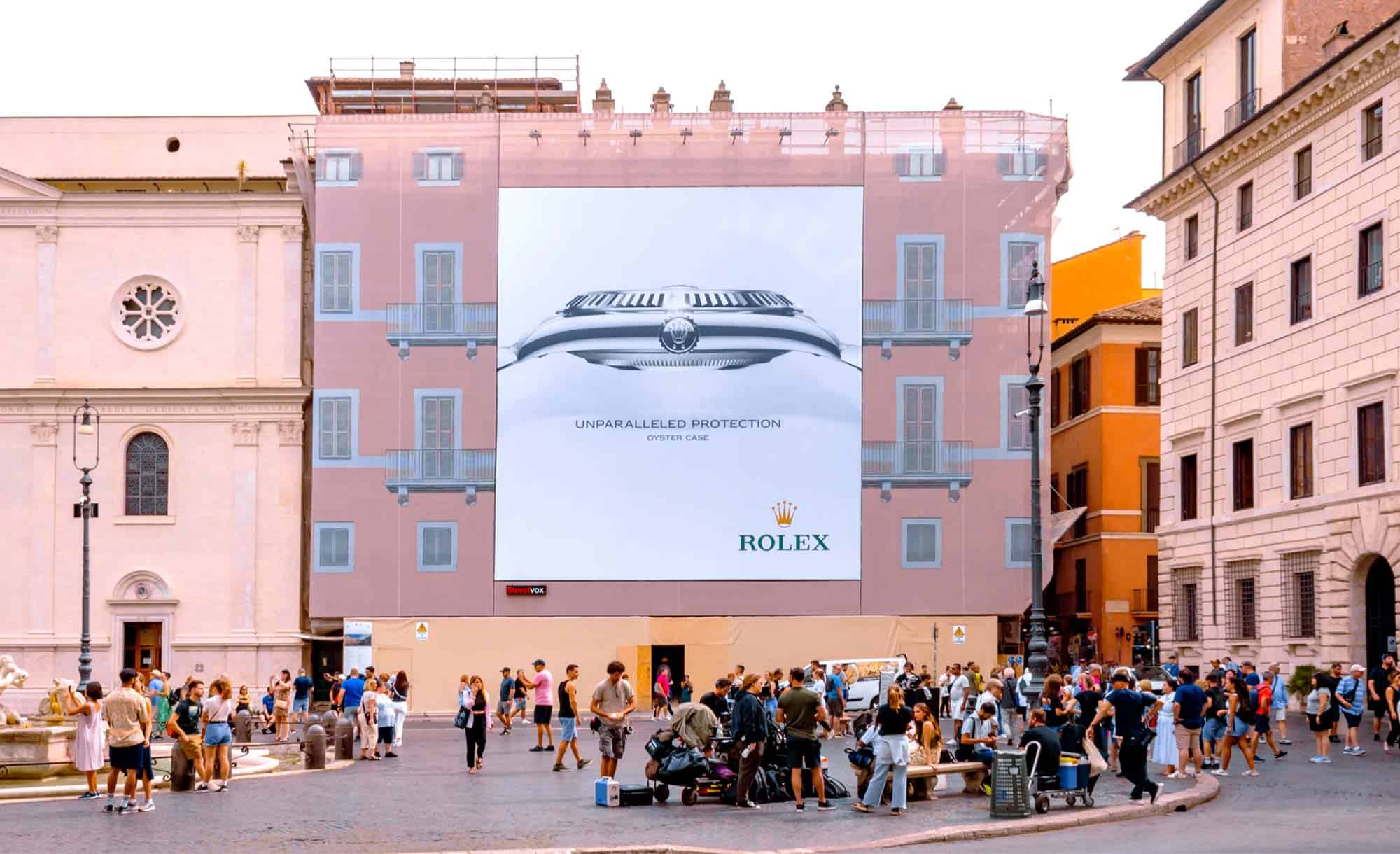 billboard in Piazza Noavona 106, Rome with Rolex (luxury)