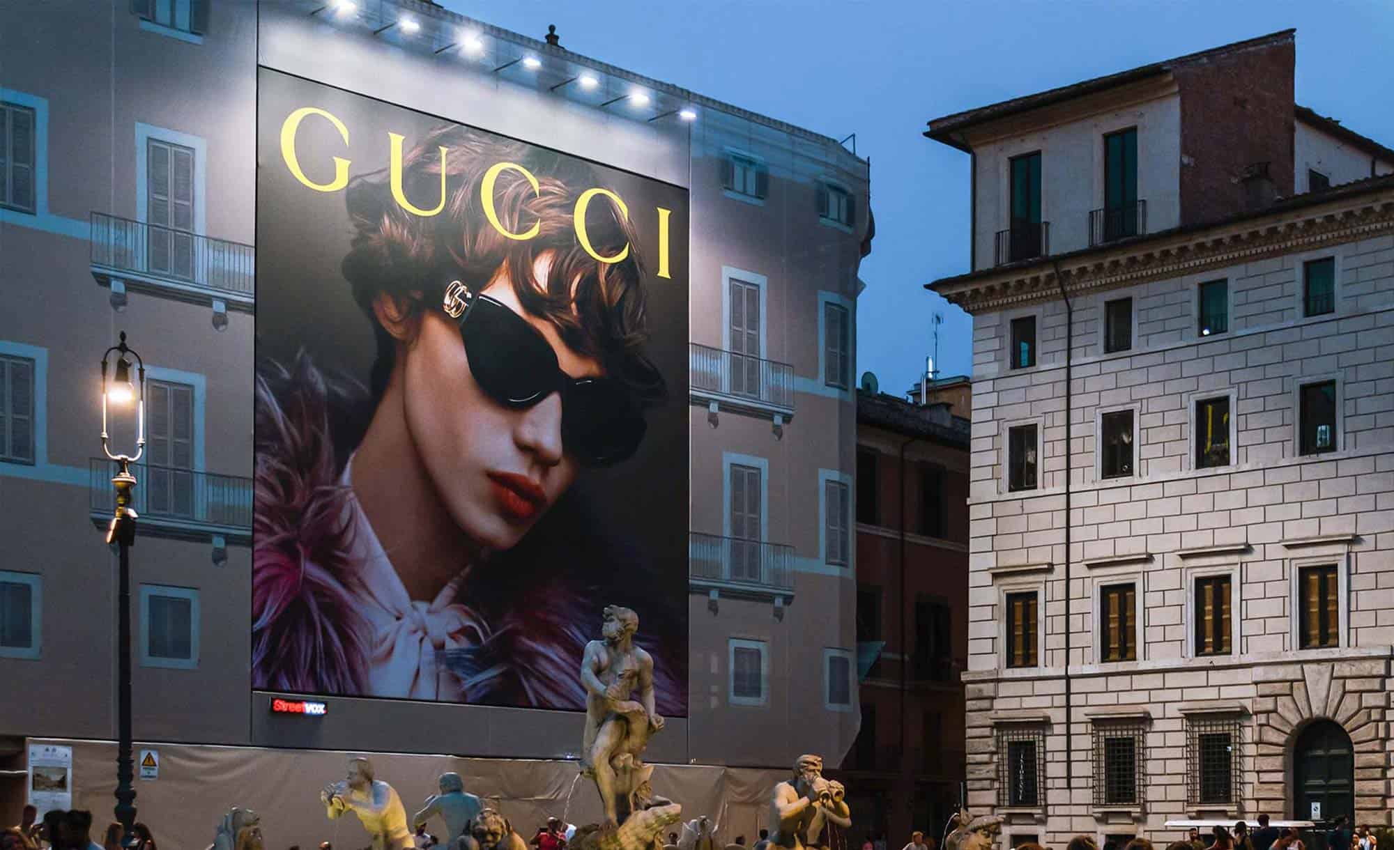 billboard in Piazza Noavona 106, Rome with Gucci (fashion)